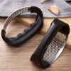 Just use the hand-operated garlic press to crush the garlic. It's easy to use and clean. It's a practical kitchen gadget
